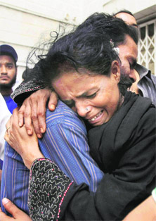 Victims relatives mourn in Karachi on Wednesday.