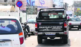 Law enforcer turns law breaker: A police jeep along with other vehicles stands parked in a no-parking zone on the Old GT Road in Jalandhar on Wednesday