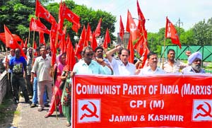 Activists of the CPM protest against the UPA government outside the Divisional Commissioners office in Jammu on Wednesday.