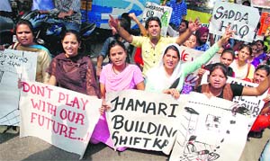 Students protest on the main gate of University of Jammu on Wednesday.
