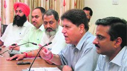 Former state president of the BJP Rajinder Bhandari (extreme right) addresses the media in Ludhiana on Wednesday. photo: inderjeet verma