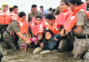 Police arrests two women who were part of the Jal Satyagraha in Narmada river at the Khardana village in Harda district on Wednesday.  PTI