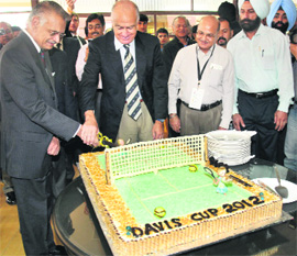 UT Administrator Shivraj V Patil cuts a special cake at his residence in Sector 6, Chandigarh, on Thursday
