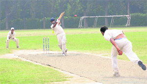 A batsman plays a shot during a match held at Panjab University, Chandigarh, on Thursday.