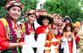 Tibetan girls wait for the arrival of the Dalai Lama in Dehradun on Thursday.