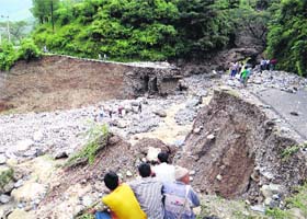 A large portion of road washed away by a cloudburst in the Soong area of Kapkot on Thursday