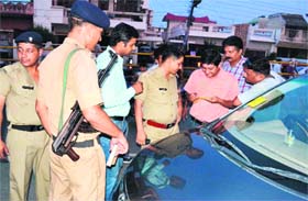 A car owner being challaned by CO, Traffic, JR Joshi for wrong parking in Haridwar on Thursday