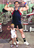 Aditya Dev Sharma with his coach. Tribune file photo