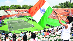 A young fan waves the Tricolour during the first Davis Cup tie in Chandigarh on Friday. Only a few spectators turned up at the CLTA Complex. Tribune photo: Pradeep Tewari