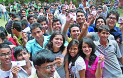 Ramjas College students show their IDs as they queue up to cast votes or the DUSU elections on Friday. Tribune photo: Manas Ranjan Bhui