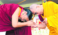 A lama meets the Dalai Lama during his visit to Dehradun on Friday. Tribune photo: Vinod Pundir