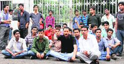 ABVP workers stage a dharna in front of the main gate of DAV (PG) College in Dehradun on Friday. Tribune photo: Vinod Pundir 