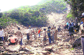 A disaster relief team and villagers look for survivors in the debris following a cloudburst in the Ukhimath area on Friday.