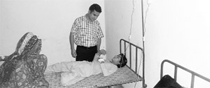 A doctor examines a patient at the community health centre, Bhuna, in Fatehbad district on Friday. 