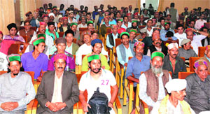 Kardars take part in a meeting at Dev Sadan in Kullu.