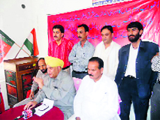 BJP leader Ashok Khajuria addresses a press conference in Srinagar.