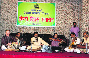 Artistes perform during Hindia Diwas function in Srinagar on Friday.