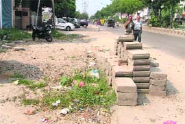The site where the work of laying tiles has been suspended on the Gill road in Ludhiana. 