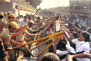 Police stop activists of Tamil Nadu Muslim Munnetra Kazhagam during a protest against an 'anti-Islam film outside the US Consulate in Chennai on Friday.