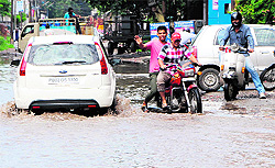 A view of a road at Joshi Colony after rain in Amritsar on Saturday
