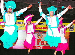 Students perform bhangra during the youth festival at Guru Nanak Dev University in Amritsar on Saturday