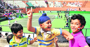 Children celebrate Indias win in a Davis Cup match at the CLTA courts, Sector 10, in Chandigarh on Saturday.