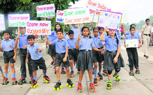 Students of Dikshant International School participate in an environmental awareness rally at the Sukhna Lake in Chandigarh on Saturday.