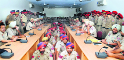 Police personnel in the congested hall during the welfare meeting organised by the city police in Jalandhar on Saturday. Photo: Sarabjit Singh