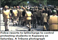 Police resorts to lathicharge to control protesting students in Kupwara on Saturday. A Tribune photograph