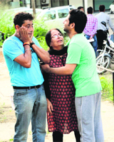 Members of his family wail. 