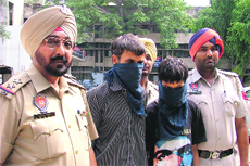 Two suspects in police custody in Ludhiana on Saturday.