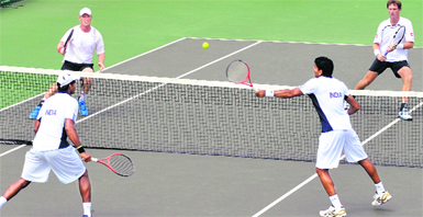 Divij Sharan volleys as Vishnu Vardhan watches during the doubles match against New Zealand in Chandigarh on Saturday.  Tribune photo: Pradeep Tewari