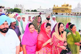 Members of the All-India Council of Mayors pay obeisance at the Golden Temple in Amritsar on Sunday.