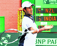 Yuki Bhamri returns a shot