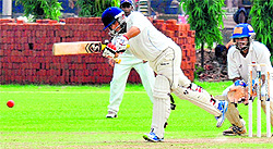 A batsman in action during a match between the IOC and Baroda at Sector 26 in Chandigarh on Sunday