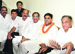 Chief Minister Vijay Bahuguna, along with his son Saket, after his formal announcement as the Congress candidate for the Tehri bypoll at Congress Bhavan in Dehradun on Sunday