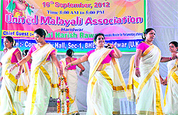 Women from Kerala perform tiruvahagara, a traditional dance, on the occasion of Onam in Haridwar on Sunday