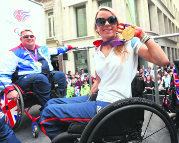 Paralympics F51 gold medal winner in the discus, Josie Pearson poses during a parade of British Olympic and Paralympic athletes through London recently. Tens of thousands of Britons took to the streets of London on Monday to welcome the stars of the Olympic and Paralympic Games and celebrate a summer of sport that surprised even the most optimistic by lifting the national mood.