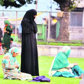 Women offer prayers at the lawns of the Hazratbal shrine in Srinagar