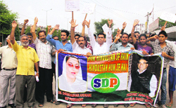 SDP activists protest against diesel hike in Jammu on Sunday. 