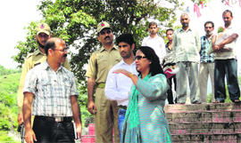 Reasi Deputy Commissioner Nirmal Sharma along with other officers reviews development work at the Nu Devi Cave Shrine near Katra on Sunday.
