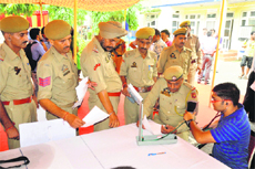 A doctor checks a patient at a medical camp at the railway station in Jammu. 