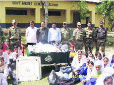 Army personnel distribute sports items to schools in Rajouri. 