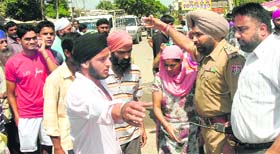 Residents stage a dharna in Jalandhar on Sunday.