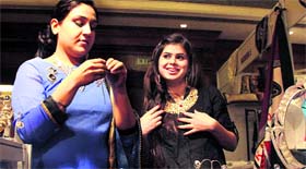 Women check out traditional jewellery at a stall of the Grand Asian Wedding Week exhibition in Jalandhar on Sunday.