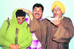 Artistes enact a scene from play Tika Lal in Srinagar on Sunday.