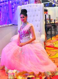 A model sports a designer dress at an exhibition in Ludhiana