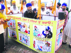 Activists find a novel way to create awareness against drug abuse and foeticide, at Bharta Kalan village in Nawanshahr on Sunday