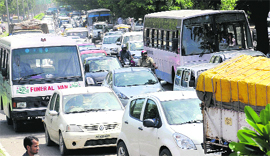 A traffic jam on the Madhya Marg during a procession of the Youth Akali Dal in Chandigarh on Monday.
