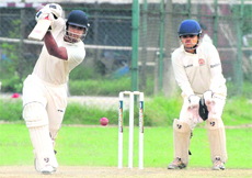 A batsman hits a shot during a JP Atray Tournament match at Sector 26, Chandigarh, on Monday. 